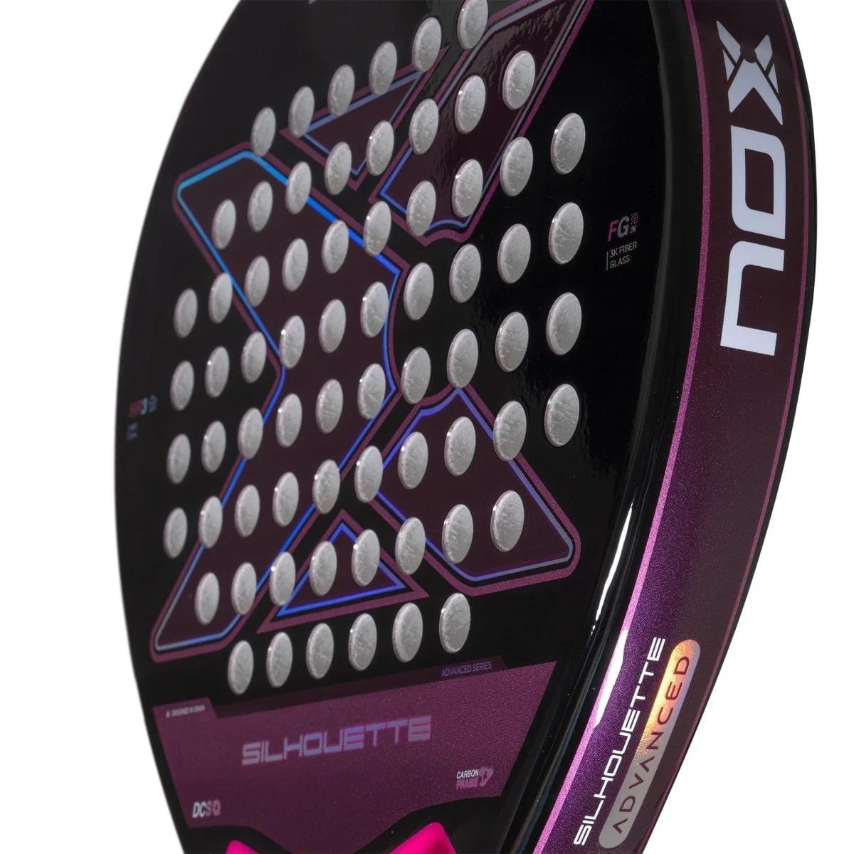 Close-up of the NOX X-One Silhouette Advance Series padel racket by NOX, featuring a black and purple design, circular holes, and "SILHOUETTE" on the edge—perfect for beginner and intermediate players.