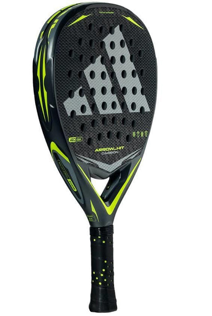 The adidas Arrow Hit Carbon 2026 Padel Racket features a black and yellow design, a perforated face with a bold gray adidas logo, and a black grip with yellow dots—ideal for advanced padel players.