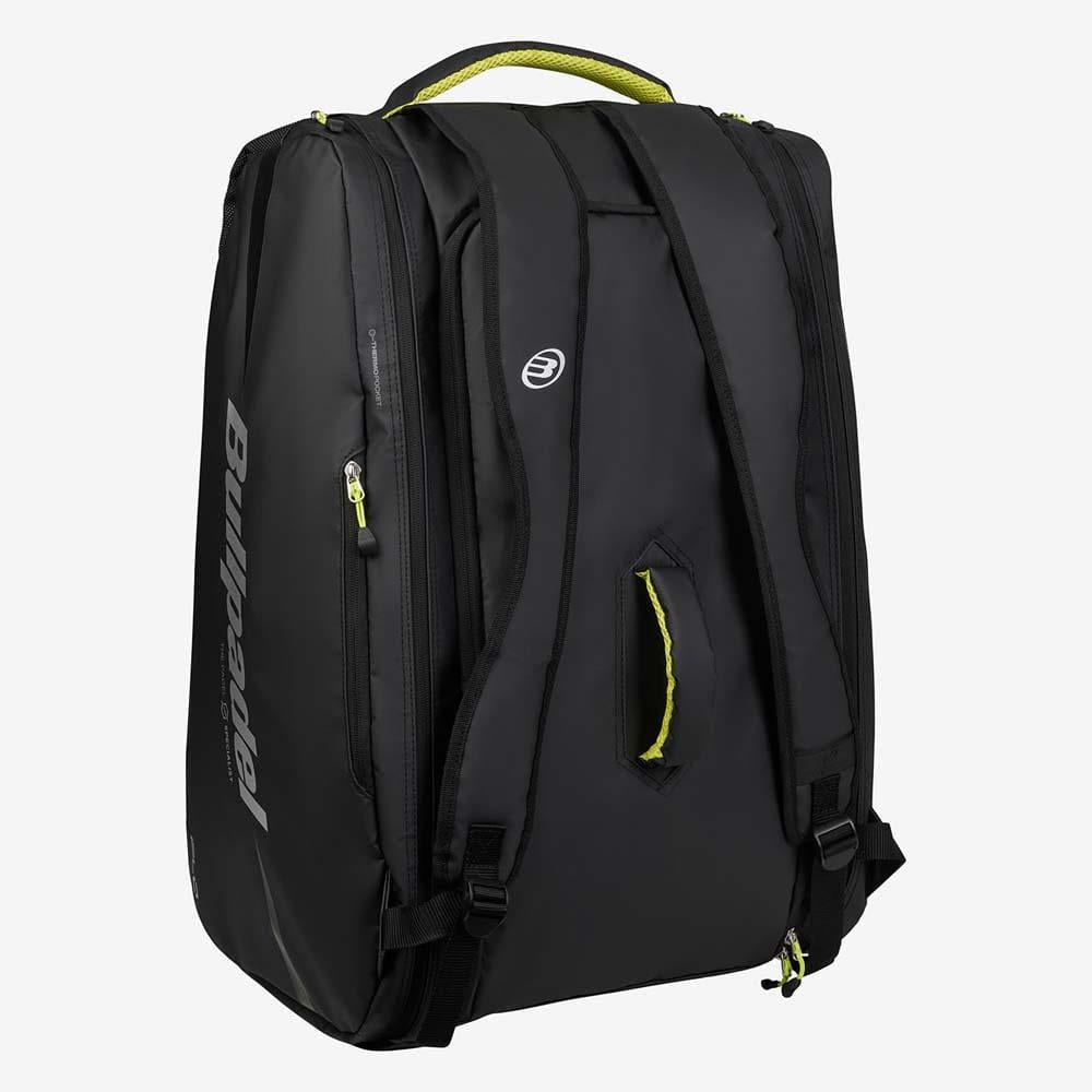 The Bullpadel BPP26022 XPLO Padel Racket Bag in black, inspired by Martín Di Nenno, features yellow-accented zippers and handle, multiple zippered compartments, padded shoulder straps, and a top handle. Brand: Bullpadel. Displayed on white background.