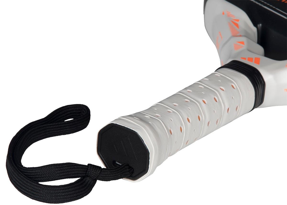 Close-up of the white handle on the adidas Metalbone Team Light 2026 padel racket, featuring perforated grip tape and a black wrist strap. The top of this advanced-level adidas racket is also partly visible.