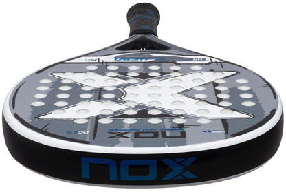 Close-up of the NOX X-Hero White Padel Racket, featuring a perforated surface with a bold "X" design—ideal for beginners wanting control and precision, with prominent NOX branding on the face and edge.