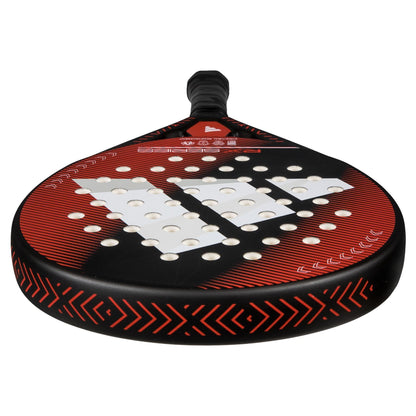The adidas RX Series Red 3.4 Padel Racket features a black and red design with white holes, geometric patterns, and red chevrons, viewed from the handle toward the rounded face—ideal for intermediate players.