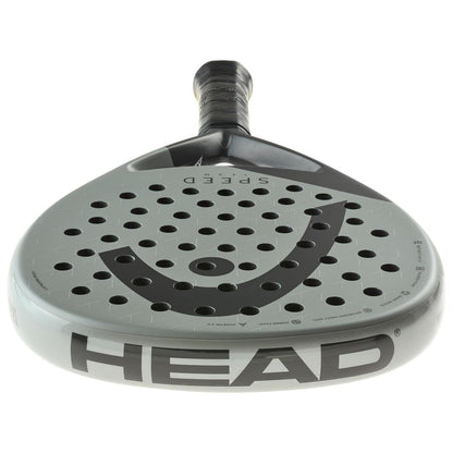 A close-up of the HEAD Speed Team 2025 Padel Racket shows its gray, perforated face with the HEAD logo, "SPEED" at the top, and "HEAD" on the edge. Featuring Auxetic 2.0 technology for enhanced power and control.