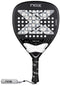 The NOX Luxury AT10 Genius Attack 18K Alum By Agustin Tapia 2026 padel racket features a black design with a large "X," white accents, perforations, a black grip with NOX logo, 18K aluminised carbon build, and white NOX-branded wrist strap.