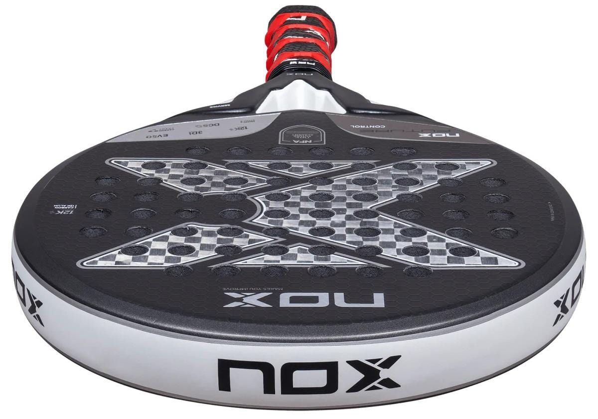 A close-up of the NOX NFA Future Control 12K Alum Padel Racket by NOX, featuring a black and white design with a central "X," Carbon 12K construction, and a black handle wrapped in red and black grip tape.