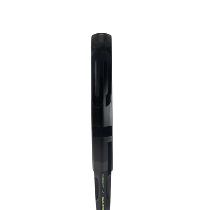 A close-up of the top handle of an adidas ADIDAS Cross It CTRL 3.4 Padel Racket, shown vertically against a plain white background, highlights its advanced design inspired by modern padel rackets.