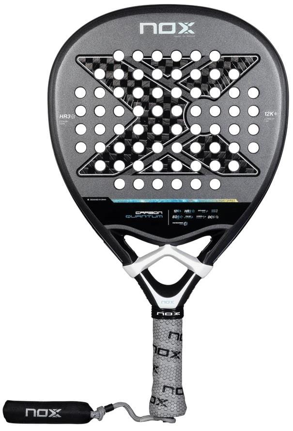 The NOX Luxury Quantum 12K Carbon 2025 Padel Racket features a black 12K carbon fiber face, white logo, perforated holes, white grip handle, EXCLUSIVE SPIN tech, and a detachable black wrist strap for enhanced control.