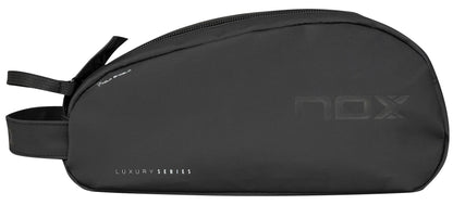 The NOX Luxury Travel Kit Bag - Black / Grey is a minimalist organiser from NOX, featuring a side handle and zip closure. Subtle branding makes it ideal as a toiletry or accessory bag for your essentials.