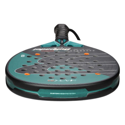 A close-up of the Bullpadel Hack 04 Hybrid 2025 Padel Racket for advanced players, featuring multiple perforations, a textured surface, and a wrapped handle by Bullpadel, viewed from the bottom.
