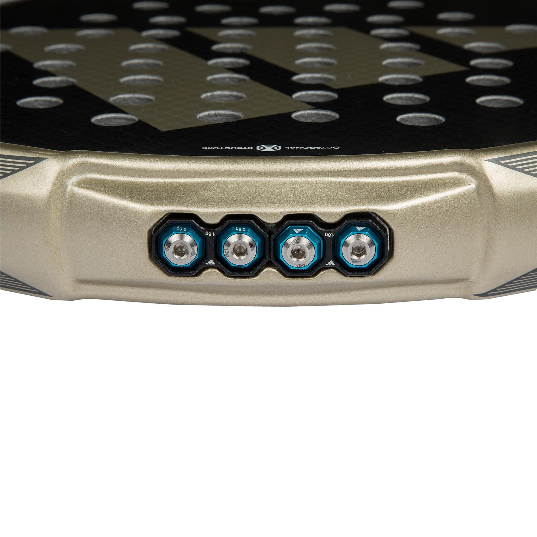 Close-up of the bottom edge of the adidas Metalbone CTRL 3.4 Padel Racket, highlighting four Weight and Balance System adjustment screws on a textured black surface and featuring its signature gold-colored premium design.
