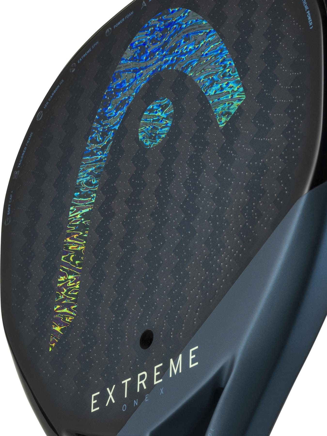 Close-up of the HEAD Extreme One X 2025 Padel Racket by HEAD, made with 12K carbon fibre and Power Foam, showcasing a holographic blue-yellow design with "EXTREME" and "ONE X" in white along the lower edge.