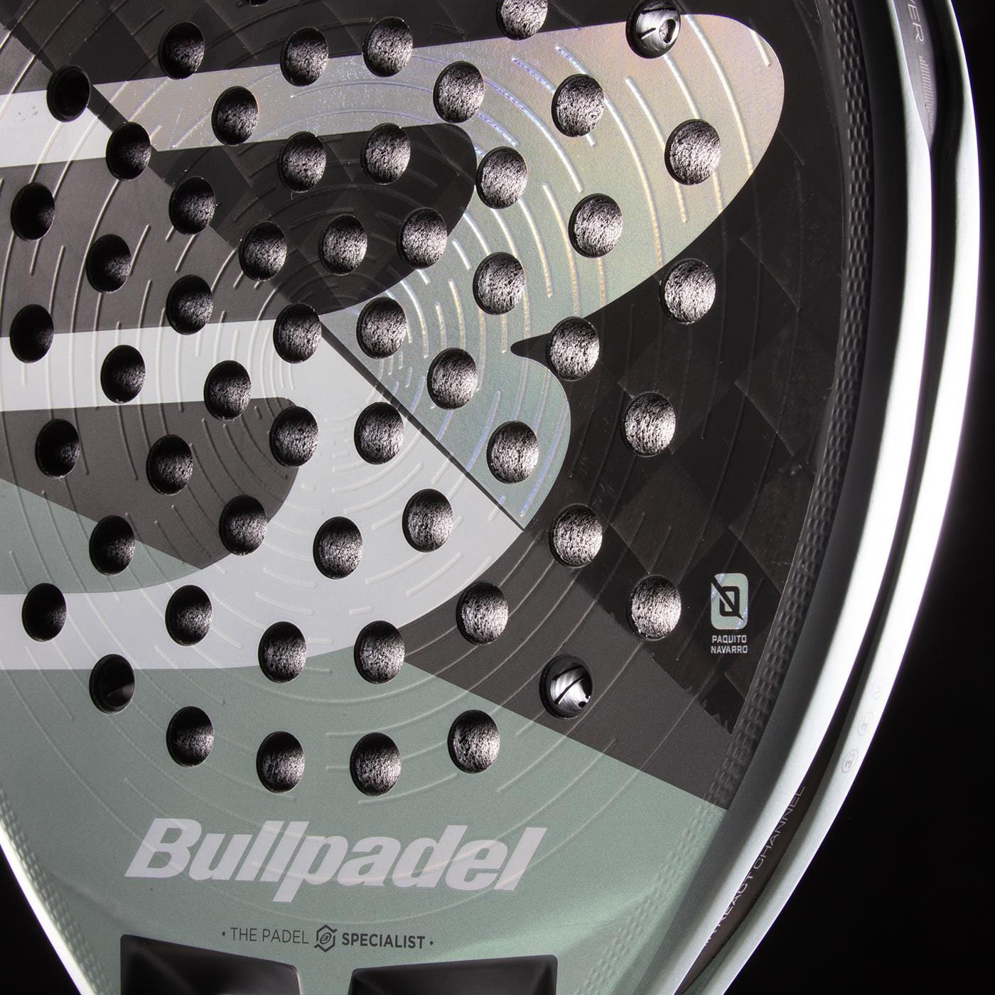 Close-up of the Bullpadel HACK 04 2026 Padel Racket by Bullpadel, highlighting its textured face, multiple holes, and prominent logo—showcasing the dynamic power and detailed craftsmanship of this high-performance padel racket.