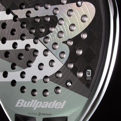 Close-up of the Bullpadel HACK 04 2026 Padel Racket by Bullpadel, highlighting its textured face, multiple holes, and prominent logo—showcasing the dynamic power and detailed craftsmanship of this high-performance padel racket.