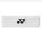 The Yonex AC259 Padel Headband in white, featuring a black logo of overlapping circles and triangles, is showcased resting horizontally on a plain background. This sporty Yonex accessory is sweat-absorbing and includes an anti-bacterial feature for enhanced comfort during intense activities.