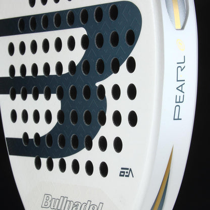 Close-up of the Bullpadel Pearl 2026 Padel Racket by Bullpadel, featuring a perforated surface, logo, and "Pearl" on the side with black and gold accents—lightweight design reduces arm fatigue.