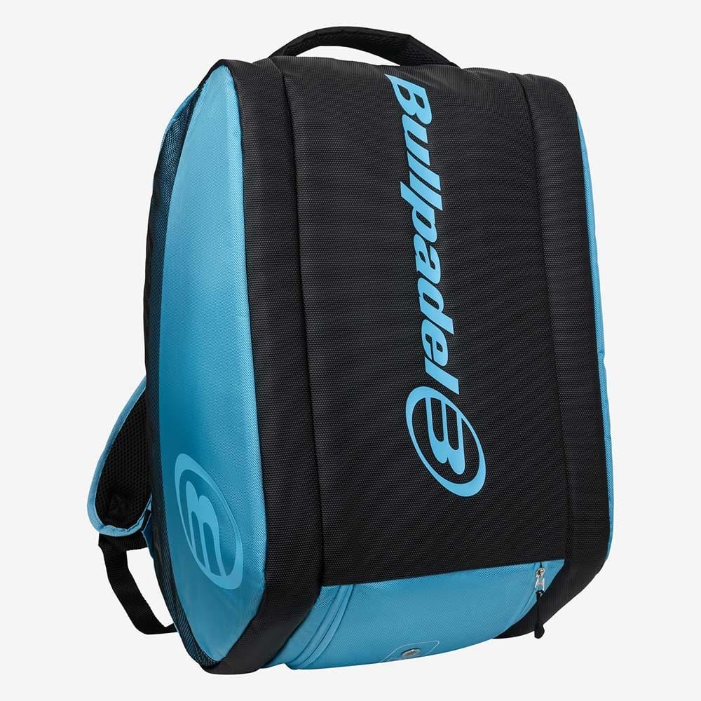 The Bullpadel BPP26003 Vertex W Padel Racket Bag in light blue stands upright, featuring the Bullpadel logo on the black front panel, visible zippers, and a top handle—ideal for carrying your padel equipment.