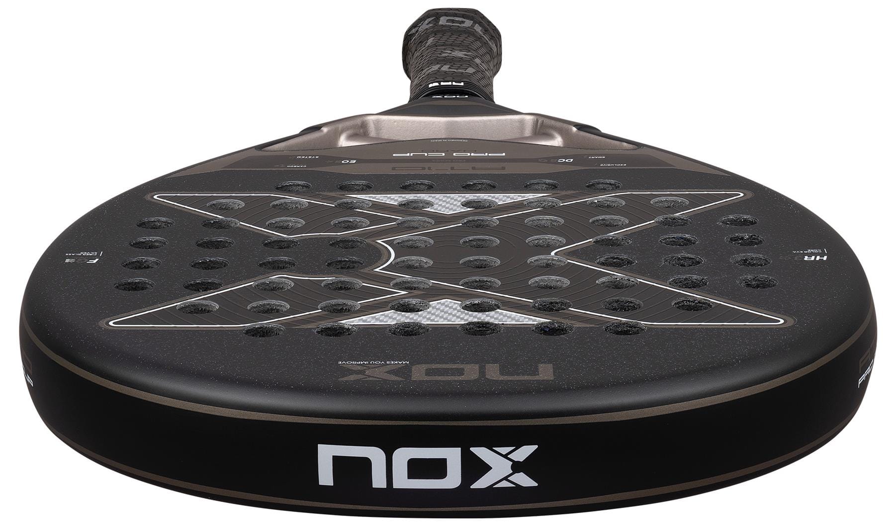 A close-up of the NOX AT10 Pro Cup Hard By Agustín Tapia 2026 padel racket, featuring a black perforated surface with the NOX logo and X-shaped design, handle angled in the background—Agustín Tapia’s top choice.