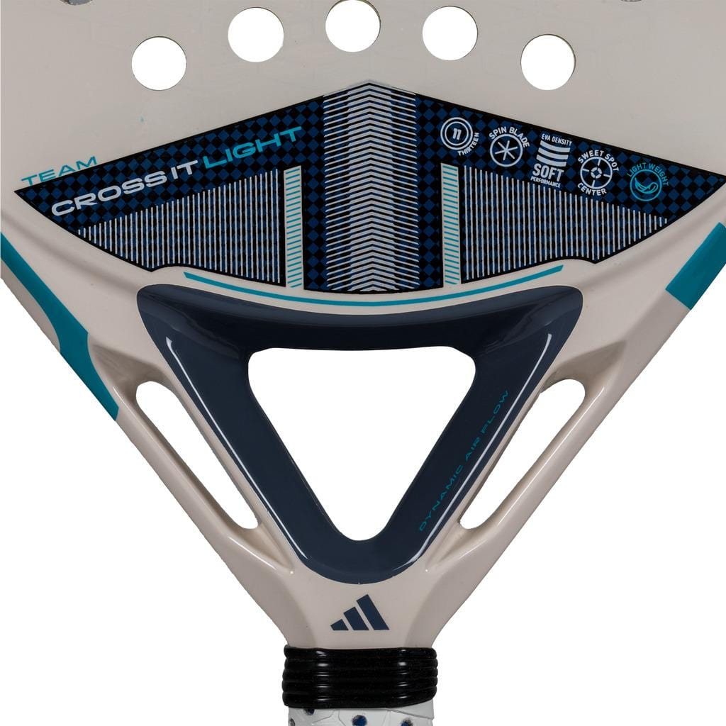 Close-up of the adidas Cross It Team Light 3.4 Padel Racket head, showcasing its beige, blue, and black design with "Cross It Light" and icons, highlighting this adidas racket’s lightweight build and advanced features.