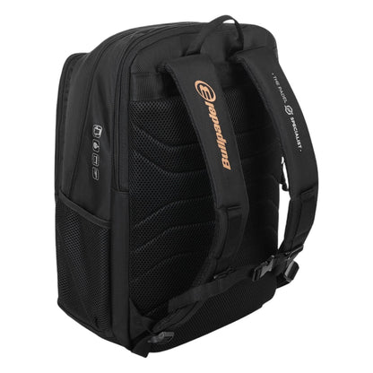 The Bullpadel Vertex 25 Padel Backpack in black boasts padded shoulder straps with orange branding and buckle closures. It features side pockets for tennis gear and breathable mesh padding for comfort.