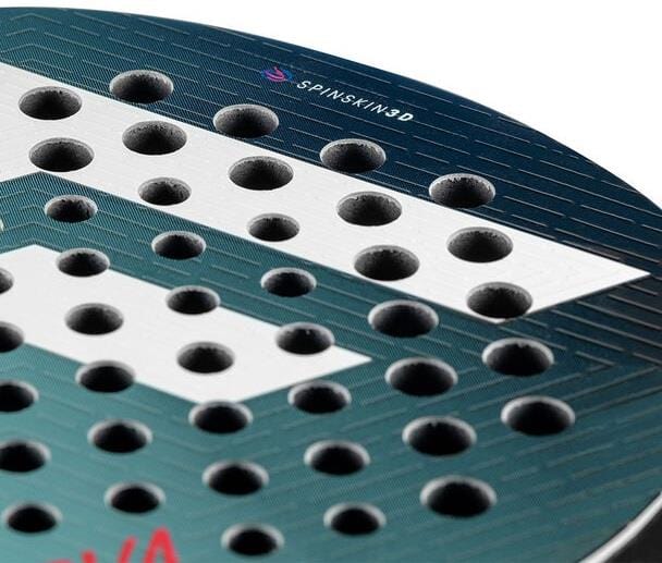 Close-up of the Tecnifibre Curva Team Padel Racket’s teardrop shape, showing its textured surface with circular holes and "SPINSKIN3D" marking near the top. Blue, white, and red accents showcase Tecnifibre's advanced spin skin 3D technology.