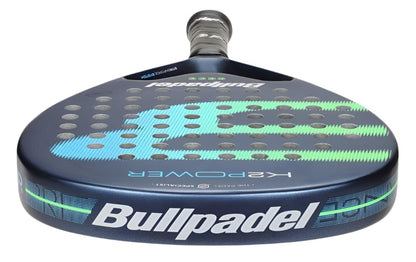 The Bullpadel K2 Power 2025 Padel Racket features a striking blue and green design with the Bullpadel logo and is ideal for players seeking power and control on the court.