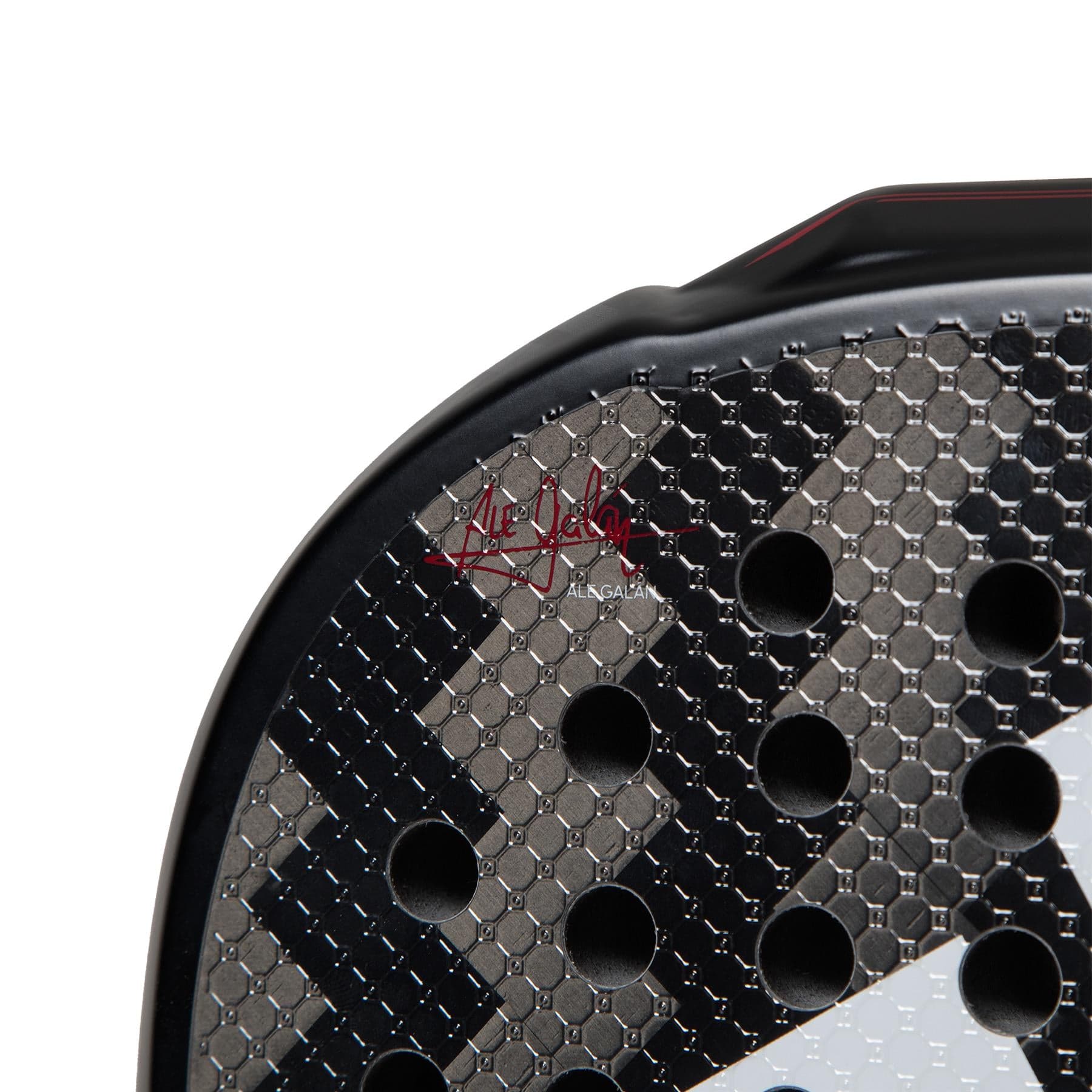 Close-up of the ADIDAS Metalbone 3.3 Padel Racket by adidas, featuring a honeycomb pattern, multiple round holes, and an advanced design.