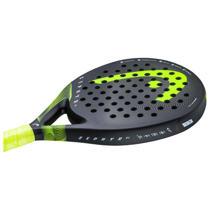The HEAD Zephyr UL 2023 Padel Racket by HEAD is black and neon yellow, features Graphene 360+ technology, circular holes, a textured surface, "ZEPHYR" side branding, and a handle with a yellow grip.
