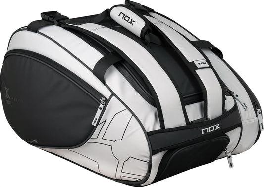 The NOX Luxury Master Series Padel Racket Bag in black and white offers multiple zippered compartments and sturdy handles, ideal for carrying your gear in style.