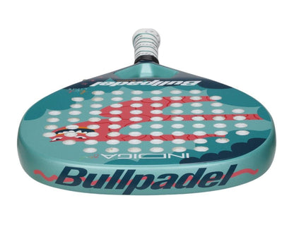 The Bullpadel Indiga Junior 25 Girls Padel Racket is a green kids’ padel racket with a red koi fish, wave patterns, white holes, and “Bullpadel” in bold dark blue on the edge—ideal for young players.