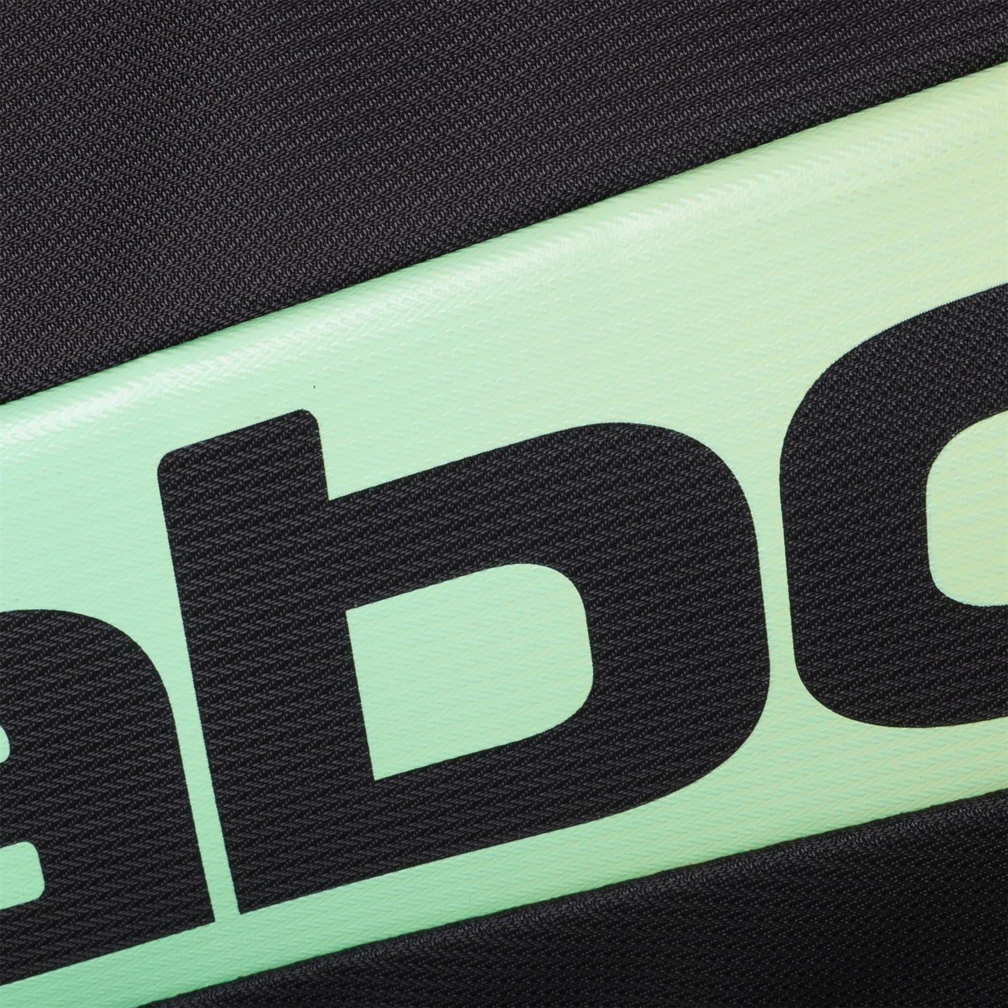 Close-up of the Babolat RH Pro Padel Racket Bag (Black / Multi), showing its textured surface, diagonal mint green strip with large black "ab" lettering, and insulated racket compartment accented by black fabric.