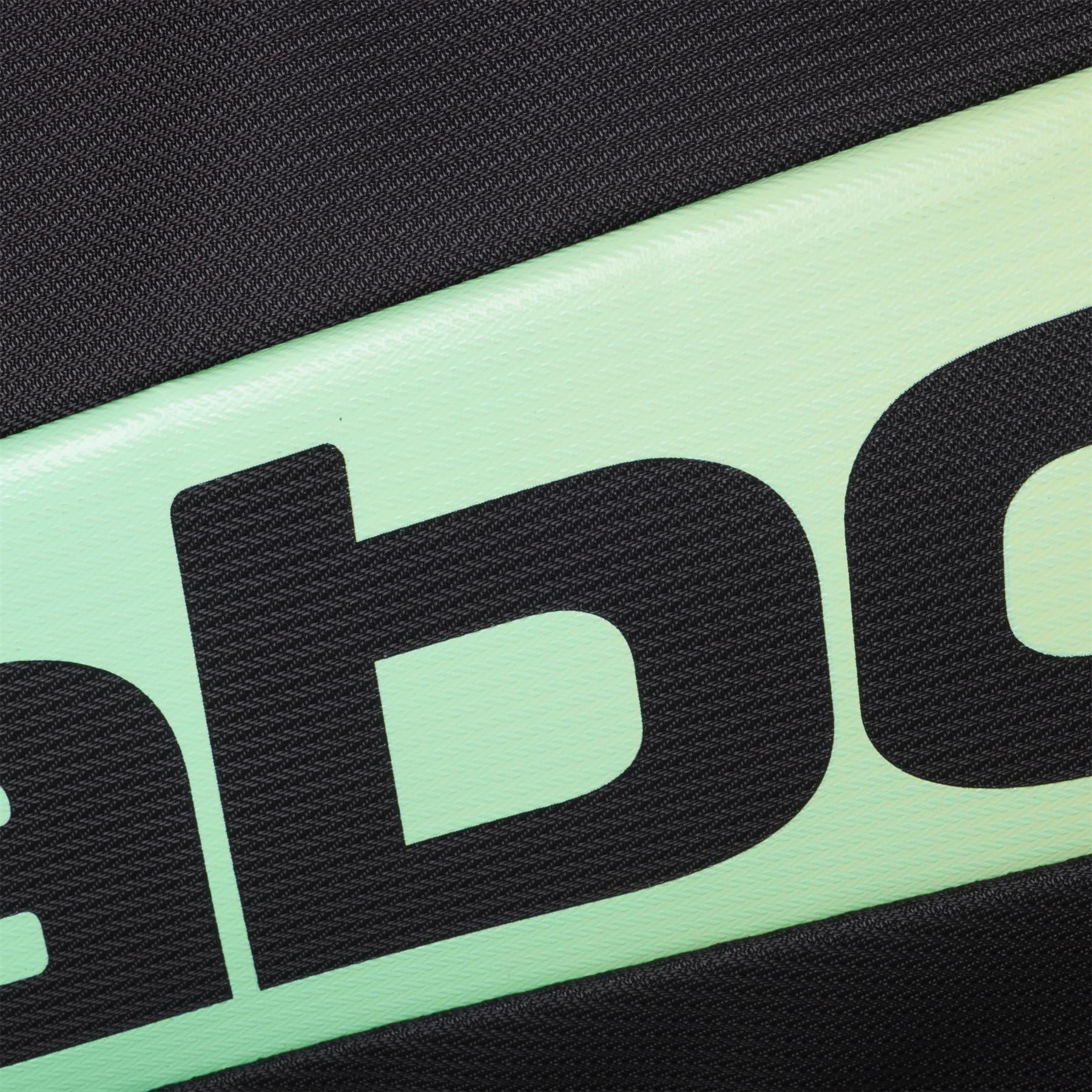 Close-up of the Babolat RH Pro Padel Racket Bag (Black / Multi), showing its textured surface, diagonal mint green strip with large black "ab" lettering, and insulated racket compartment accented by black fabric.