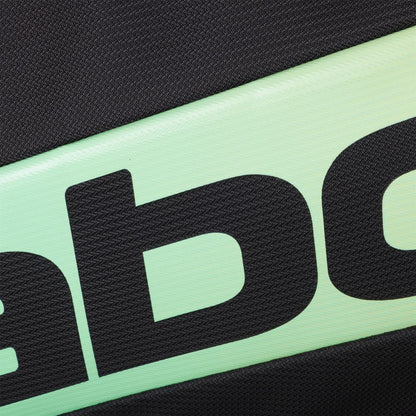 Close-up of the Babolat RH Pro Padel Racket Bag (Black / Multi), showing its textured surface, diagonal mint green strip with large black "ab" lettering, and insulated racket compartment accented by black fabric.