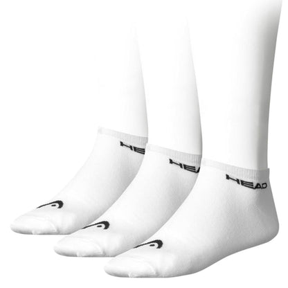 The HEAD Sneaker Padel Socks (3 Pack) in White/Black are crafted from a soft cotton blend for comfort. They feature a black logo on the toes and "HEAD" branding on the ankle, displayed on mannequin feet against a white backdrop.