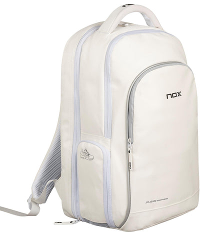 The NOX Pro Series Padel Backpack - White by NOX features a large main compartment, front zip pocket, side shoe pocket, top handle, and light gray zippers with mesh details for a stylish padel-ready look.