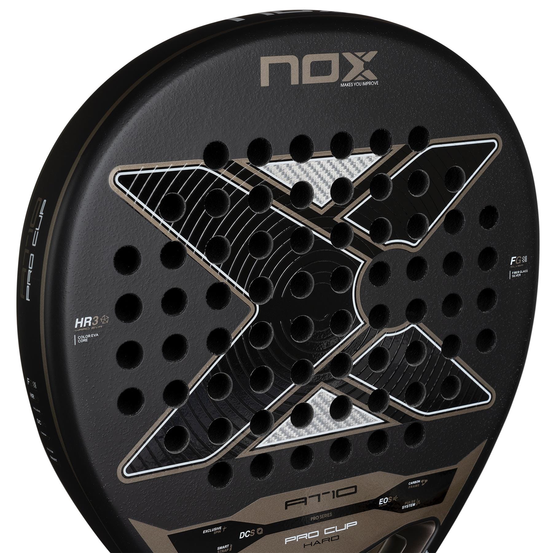 Close-up of the NOX AT10 Pro Cup Hard By Agustín Tapia 2026 padel racket in black, featuring a large silver X, multiple round holes, branding, and technical details on its top and sides. Signature model of player Agustín Tapia.