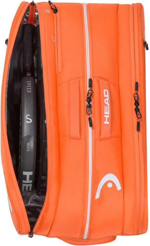 The orange HEAD Tour 2026 Padel Racket Bag L by HEAD is unzipped to show rackets inside, featuring multiple zippered compartments and the white HEAD logo on the side.