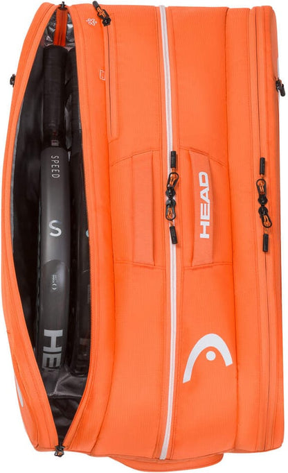 The orange HEAD Tour 2026 Padel Racket Bag L by HEAD is unzipped to show rackets inside, featuring multiple zippered compartments and the white HEAD logo on the side.