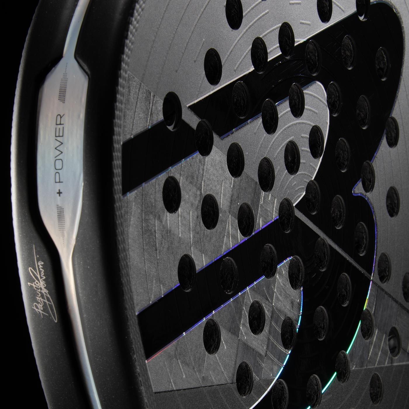 Close-up of the Bullpadel HACK 04 Hybrid 2026 Padel Racket, featuring round holes, a prominent “S” logo, a signed edge with “POWER” in metallic, and Total Channel technology by Bullpadel for top performance.
