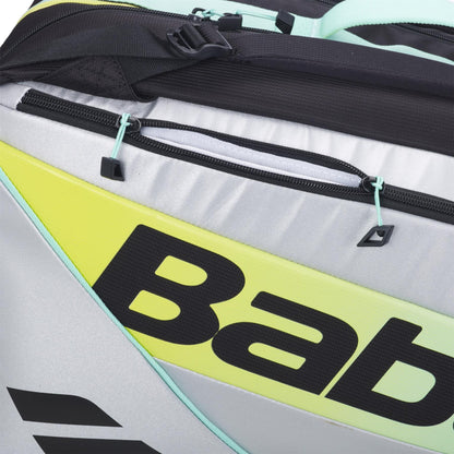 Close-up of the Babolat RH Pro Padel Racket Bag in Black/Multi with gray, yellow, and mint green accents, bold partially visible “Bab” branding, black zipper and straps, and a spacious design for padel gear.