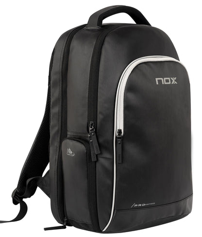 The NOX Pro Series Padel Backpack in black features a top handle, padded shoulder straps, multiple zippered compartments, and a spacious front pocket with the NOX logo in white for all your essentials.