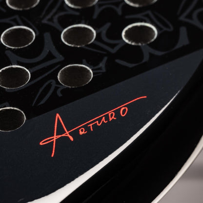 Close-up of the HEAD Coello Vibe 2025 padel racket from HEAD, featuring a teardrop shape with circular holes and subtle design details—ideal for beginners seeking quality performance.