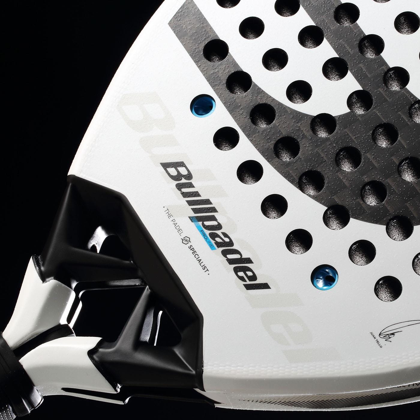 Close-up of the Bullpadel Vertex 05 2026 padel racket in white with black and grey accents, featuring the Bullpadel logo, round perforations, and a glimpse of the handle set against a black background.