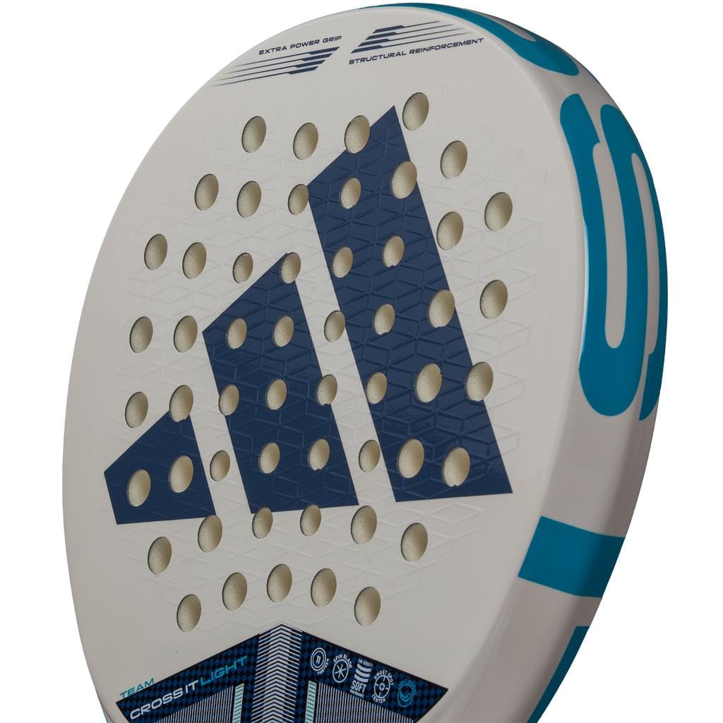 Close-up of the adidas Cross It Team Light 3.4 Padel Racket, an advanced-level, lightweight padel racket in white with bold blue geometric patterns, several round holes on the face, and teal edge accents.