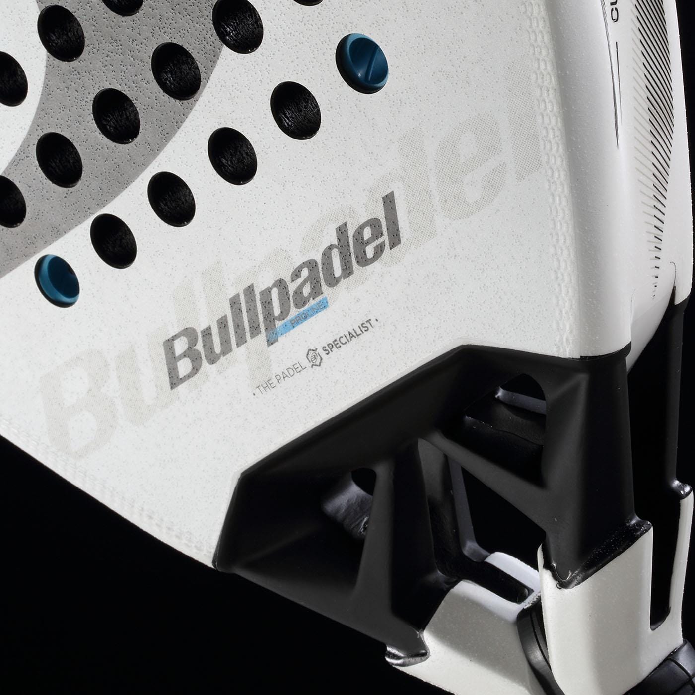 Close-up of the Bullpadel Vertex 05 2026 Padel Racket, showcasing the Bullpadel logo, perforated surface, and handle detail against a black background.