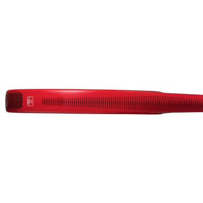 A close-up of the adidas ADIDAS RX Series Red Padel Racket handle, viewed from the side, highlights black ventilation grooves and a small white logo near the end—ideal for beginner padel players.