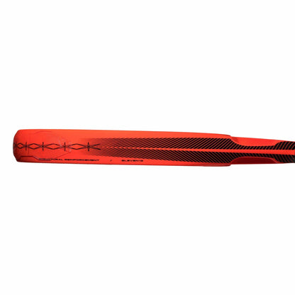 A close-up of a bright red adidas ADIDAS Cross It Padel Racket with black graphic designs and text, inspired by the power and spin of a professional padel racket.