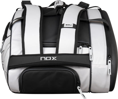The NOX Luxury Master Series Padel Racket Bag in black and white features multiple zippered compartments, padded shoulder straps, and prominent NOX branding—perfect for padel enthusiasts.