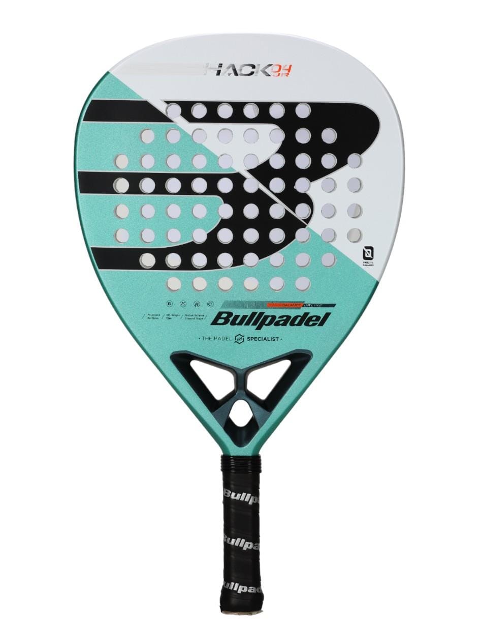 The Bullpadel Hack Junior 25 Padel Racket is a junior padel racket with a turquoise and white design, black grip, carbon fibre frame, circular holes on the face, and visible Bullpadel branding.