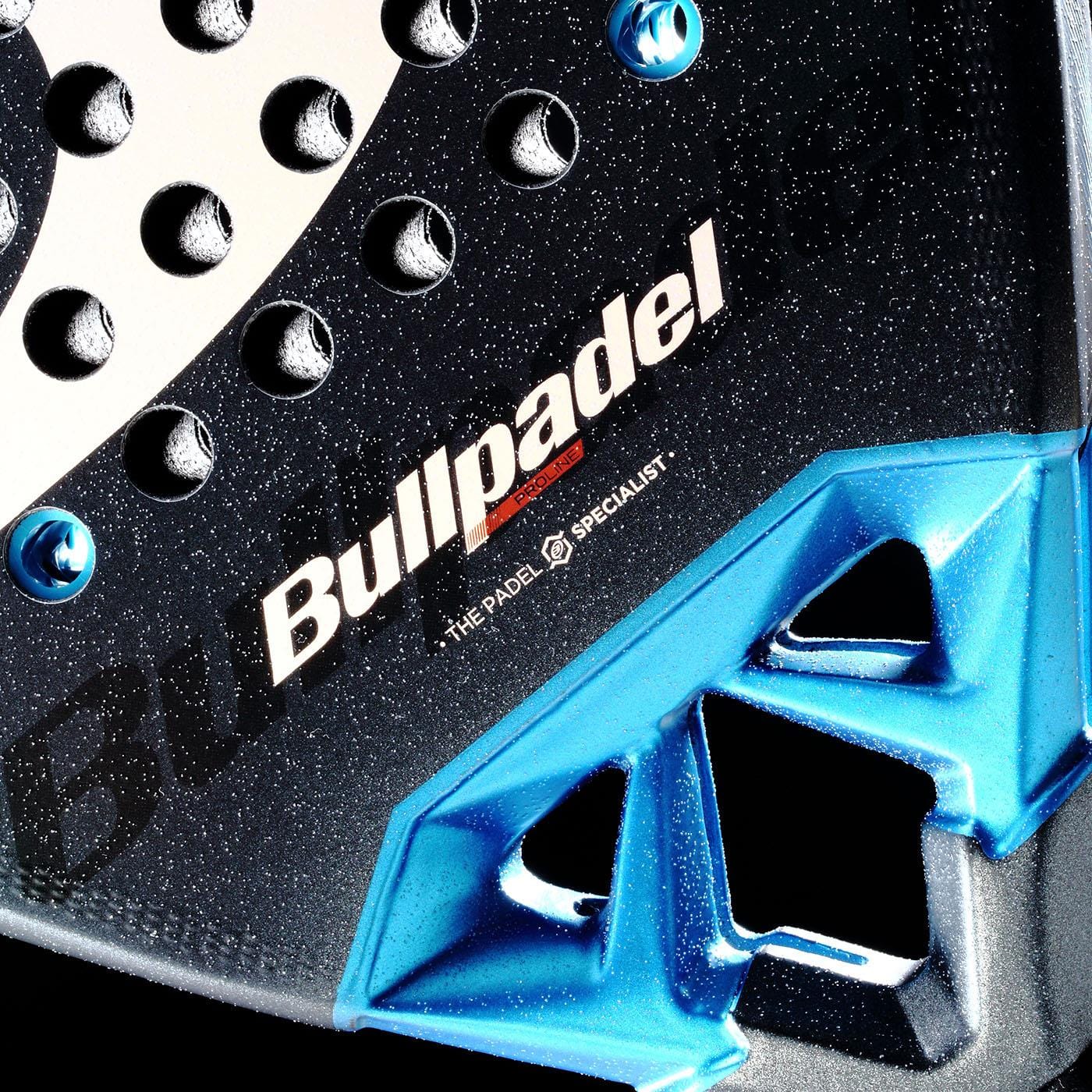 Close-up of the Bullpadel Vertex 05 Comfort 2026 Padel Racket, featuring a textured Fibrix fibre surface, white and red Bullpadel logo, and blue geometric details on the lower part.