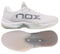 The NOX AT10 Lux Mens Padel Shoes in White/Grey are shown from side and bottom views, featuring "NOX" branding, a textured sole, and a mesh upper—designed for peak performance inspired by Agustin Tapia.